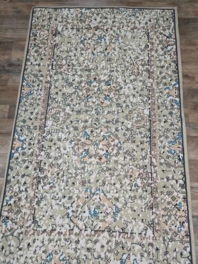 Beige Patterned Area Rug with Blue & Tan Accents